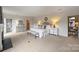 Large main bedroom with seating, bedside tables, and sophisticated decor at 4020 Barclay Downs Dr, Charlotte, NC 28209