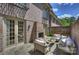 Outdoor patio with a brick fireplace, stone flooring and comfortable seating surrounded by brick walls at 4020 Barclay Downs Dr, Charlotte, NC 28209