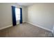 Neutral bedroom with plush carpet and window with curtain for filtered natural light at 4143 Kenton Glenn Nw Ct, Concord, NC 28027