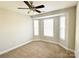 Bright bedroom with a ceiling fan, plush carpet, and lots of natural light from large windows at 4143 Kenton Glenn Nw Ct, Concord, NC 28027