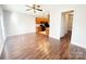 Open living area with wood floors connects to the kitchen, creating a seamless flow at 4143 Kenton Glenn Nw Ct, Concord, NC 28027