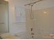 Bathroom featuring a vanity with white cabinets, toilet, and bathtub with shower and mounted white storage cabinet at 428 Lexie Ln # 100, Rock Hill, SC 29732