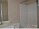Bathroom featuring a vanity with white cabinets, toilet, and bathtub with shower at 428 Lexie Ln # 100, Rock Hill, SC 29732