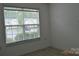 Bedroom with a window overlooking the neighborhood, hardwood floor, and light walls at 428 Lexie Ln # 100, Rock Hill, SC 29732