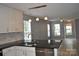 Open kitchen with stone backsplash, stainless steel dishwasher and granite countertop island at 428 Lexie Ln # 100, Rock Hill, SC 29732