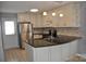 Modern kitchen with stainless steel appliances, granite countertops, and stylish lighting at 428 Lexie Ln # 100, Rock Hill, SC 29732