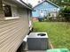 Backyard features a view of the next-door house, grass, fence and AC unit at 439 17Th St, Cramerton, NC 28032
