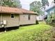 An expansive backyard featuring a grassy yard, chain link fence, and the exterior of a light brown vinyl sided home at 439 17Th St, Cramerton, NC 28032