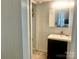 Clean bathroom features a modern black vanity, sleek fixtures, mirror and white walls at 439 17Th St, Cramerton, NC 28032