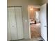 Bedroom features neutral walls, closet, and an open doorway leading to a sunny living area at 439 17Th St, Cramerton, NC 28032