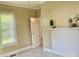 Bright bedroom with a large window and classic decorative fireplace at 439 17Th St, Cramerton, NC 28032