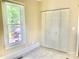 Bright bedroom features a window with view of the yard and folding door closet, carpet floor at 439 17Th St, Cramerton, NC 28032