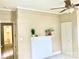 Bedroom features neutral walls, fireplace, fan, and a door to another room at 439 17Th St, Cramerton, NC 28032