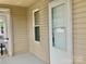 A light-filled front entry with a window and exterior door to the porch at 439 17Th St, Cramerton, NC 28032