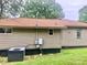 Side view of the home, showing vinyl siding, windows, and AC unit outside at 439 17Th St, Cramerton, NC 28032