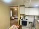 Open kitchen showcases white cabinetry, an island, and a view into the living room at 439 17Th St, Cramerton, NC 28032