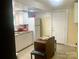 Functional kitchen space featuring white cabinets, ample counter space, and essential appliances at 439 17Th St, Cramerton, NC 28032