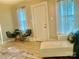 Inviting living room featuring a comfortable white chaise and stylish, modern chairs, perfect for relaxing or entertaining at 439 17Th St, Cramerton, NC 28032