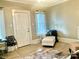 Cozy living space with a white chaise, decorative pillows and blanket, modern chairs and neutral tones, ideal for relaxation at 439 17Th St, Cramerton, NC 28032