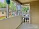 View from inside the screened-in porch looking out to the street at 439 17Th St, Cramerton, NC 28032