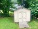 Outdoor shed with double doors and a ramp in a backyard at 439 17Th St, Cramerton, NC 28032