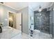 This stylish bathroom offers marble flooring, vanity top and an amazing shower with a chandelier at 4501 Montibello Dr, Charlotte, NC 28226