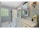 This bathroom offers marble flooring and vanity top, framed mirror and natural light at 4501 Montibello Dr, Charlotte, NC 28226