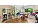 Bright breakfast nook with banquette seating and view to living area and a deck at 4501 Montibello Dr, Charlotte, NC 28226