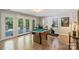 This room features a pool table, large glass doors and exercise bike at 4501 Montibello Dr, Charlotte, NC 28226