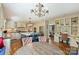 Open kitchen featuring custom cabinets, an island, hardwood floors and an adjacent office at 4501 Montibello Dr, Charlotte, NC 28226