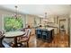 Eat in kitchen featuring custom cabinets, an island, and natural lighting at 4501 Montibello Dr, Charlotte, NC 28226