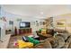 Open living room featuring hardwood floors, staircase, large sofa, and TV at 4501 Montibello Dr, Charlotte, NC 28226