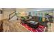 Open living room featuring hardwood floors, staircase, large sofa, and glass doors at 4501 Montibello Dr, Charlotte, NC 28226