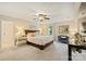 Spacious main bedroom features neutral colors, a ceiling fan, and comfortable seating area at 4501 Montibello Dr, Charlotte, NC 28226