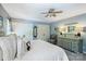 Comfortable main bedroom features a ceiling fan, neutral paint and an elegant dresser with matching mirror at 4501 Montibello Dr, Charlotte, NC 28226