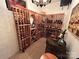A wine cellar featuring custom wine racks and a wooden barrel at 4501 Montibello Dr, Charlotte, NC 28226