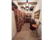 A wine cellar featuring custom wine racks and a chandelier at 4501 Montibello Dr, Charlotte, NC 28226