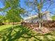 Beautiful backyard featuring a stained deck perfect for gatherings, with a lawn area and mature trees at 4656 Chaucer Nw Pl, Concord, NC 28027