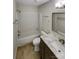 Bathroom featuring a shower-tub combo, modern vanity, and decorative mirror at 4656 Chaucer Nw Pl, Concord, NC 28027