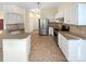 Well-equipped kitchen boasts stainless steel appliances, granite countertops, and an open design for easy entertaining at 4656 Chaucer Nw Pl, Concord, NC 28027