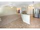 Modern kitchen with stainless steel appliances, breakfast bar, and an open view into the spacious living area at 4656 Chaucer Nw Pl, Concord, NC 28027