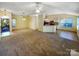 Large living area with an open layout, featuring a breakfast bar, ample natural light, and seamless flow to the kitchen at 4656 Chaucer Nw Pl, Concord, NC 28027
