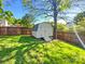 Backyard shed for extra storage with steps inside a fenced yard at 4656 Chaucer Nw Pl, Concord, NC 28027