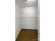 Walk-in closet featuring carpet and built-in metal shelving on all sides at 4656 Chaucer Nw Pl, Concord, NC 28027