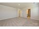 Bonus room featuring plush carpeting and neutral walls leading to the bathroom at 5017 Poplin Vly, Cherryville, NC 28021