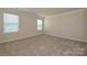 Carpeted bonus room with two large windows offering plenty of natural light at 5017 Poplin Vly, Cherryville, NC 28021