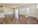 Bright living room featuring hardwood floors, large windows, sliding glass doors, and neutral walls at 5017 Poplin Vly, Cherryville, NC 28021