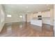 Open-concept living space boasting hardwood floors, natural light, and a seamless flow to the kitchen at 5017 Poplin Vly, Cherryville, NC 28021