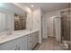 Modern bathroom with double sink vanity with quartz countertops and a tiled walk-in shower at 5018 Poplin Vly, Cherryville, NC 28021