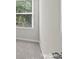 Corner bedroom with view of trees through blinds on the windows at 5024 Colline Ct, Charlotte, NC 28216